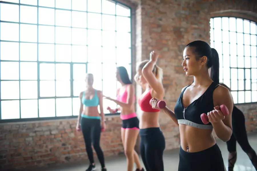 women doing physical group exercise